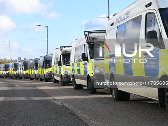 A row of police vehicles is outside Wembley prior to the UEFA Nations League 2024/5, League B, Group B2 match between England and the Republ...