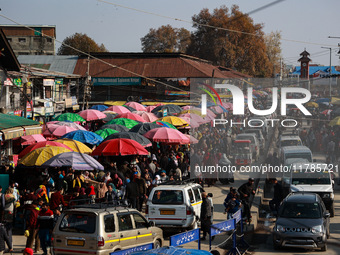 Kashmiri people purchase woolen clothes and other daily need products from the Sunday market ahead of harsh winters in Sopore, Jammu and Kas...