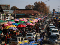 Kashmiri people purchase woolen clothes and other daily need products from the Sunday market ahead of harsh winters in Sopore, Jammu and Kas...