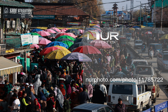 Kashmiri people purchase woolen clothes and other daily need products from the Sunday market ahead of harsh winters in Sopore, Jammu and Kas...