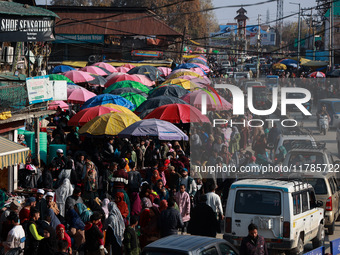 Kashmiri people purchase woolen clothes and other daily need products from the Sunday market ahead of harsh winters in Sopore, Jammu and Kas...