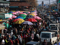 Kashmiri people purchase woolen clothes and other daily need products from the Sunday market ahead of harsh winters in Sopore, Jammu and Kas...