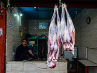 A butcher who sells mutton waits for customers in Sopore, Jammu and Kashmir, India, on November 17, 2024. (