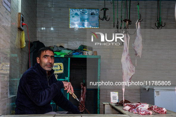 A butcher who sells mutton waits for customers in Sopore, Jammu and Kashmir, India, on November 17, 2024. 