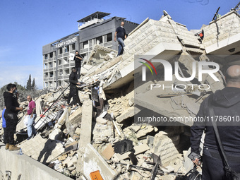 A view of damaged buildings in the Al Hadath neighborhood after an Israeli airstrike in the Dahieh region of Beirut, Lebanon, on November 17...