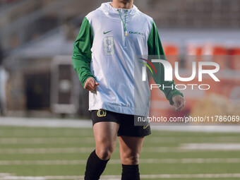 Oregon quarterback Dillon Gabriel #8 warms up at Camp Randall Stadium against the Wisconsin Badgers in Madison, Wisconsin, on November 16, 2...