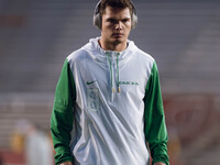 Oregon quarterback Dillon Gabriel #8 warms up at Camp Randall Stadium against the Wisconsin Badgers in Madison, Wisconsin, on November 16, 2...