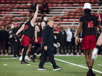 Wisconsin Badgers Offensive Coordinator Phil Longo looks on as the Wisconsin Badgers warm up at Camp Randall Stadium against the Oregon Duck...