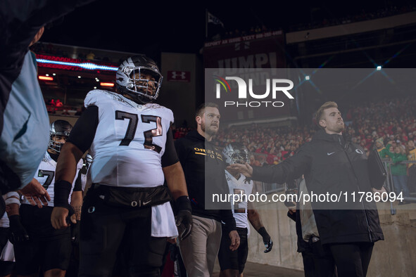 Oregon head coach Dan Lanning leads the Oregon Ducks out of the tunnel at Camp Randall Stadium as they take on the Wisconsin Badgers in Madi...