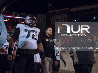 Oregon head coach Dan Lanning leads the Oregon Ducks out of the tunnel at Camp Randall Stadium as they take on the Wisconsin Badgers in Madi...