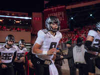 Oregon quarterback Dillon Gabriel #8 leads the Oregon Ducks out of the tunnel at Camp Randall Stadium in Madison, Wisconsin, on November 16,...