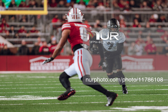 Oregon wide receiver Evan Stewart #7 eyes Wisconsin Badgers safety Austin Brown #9 as the Wisconsin Badgers take on the Oregon Ducks at Camp...