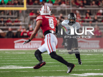 Oregon wide receiver Evan Stewart #7 eyes Wisconsin Badgers safety Austin Brown #9 as the Wisconsin Badgers take on the Oregon Ducks at Camp...