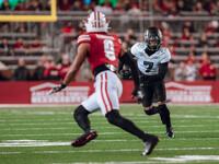 Oregon wide receiver Evan Stewart #7 eyes Wisconsin Badgers safety Austin Brown #9 as the Wisconsin Badgers take on the Oregon Ducks at Camp...