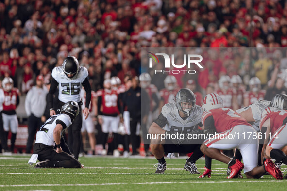 Oregon tight end Patrick Herbert #88 stares down Wisconsin Badgers cornerback Ricardo Hallman #2 before Oregon kicker Atticus Sappington #36...