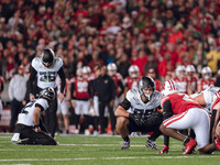 Oregon tight end Patrick Herbert #88 stares down Wisconsin Badgers cornerback Ricardo Hallman #2 before Oregon kicker Atticus Sappington #36...