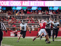 Oregon tight end Terrance Ferguson #3 heads upfield after a catch against the Wisconsin Badgers at Camp Randall Stadium in Madison, Wisconsi...