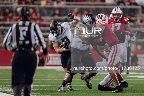 Oregon tight end Terrance Ferguson #3 heads upfield after a catch against the Wisconsin Badgers at Camp Randall Stadium in Madison, Wisconsi...