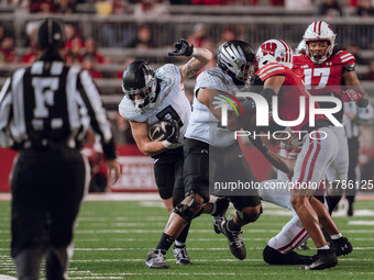 Oregon tight end Terrance Ferguson #3 heads upfield after a catch against the Wisconsin Badgers at Camp Randall Stadium in Madison, Wisconsi...