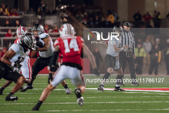 Oregon quarterback Dillon Gabriel #8 looks to pass downfield against the Wisconsin Badgers at Camp Randall Stadium in Madison, Wisconsin, on...