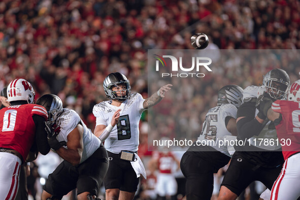 Oregon quarterback Dillon Gabriel #8 looks to pass downfield against the Wisconsin Badgers at Camp Randall Stadium in Madison, Wisconsin, on...