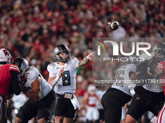 Oregon quarterback Dillon Gabriel #8 looks to pass downfield against the Wisconsin Badgers at Camp Randall Stadium in Madison, Wisconsin, on...