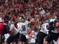 Oregon quarterback Dillon Gabriel #8 looks to pass downfield against the Wisconsin Badgers at Camp Randall Stadium in Madison, Wisconsin, on...