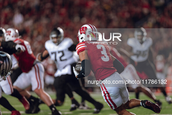 Wisconsin Badgers cornerback Nyzier Fourqurean #3 runs down the field after intercepting a pass against the Oregon Ducks at Camp Randall Sta...