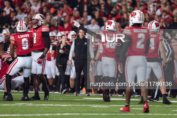 Wisconsin Badgers cornerback Xavier Lucas #10 signals a turnover against The Oregon Ducks at Camp Randall Stadium in Madison, Wisconsin, on...