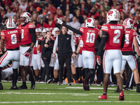 Wisconsin Badgers cornerback Xavier Lucas #10 signals a turnover against The Oregon Ducks at Camp Randall Stadium in Madison, Wisconsin, on...