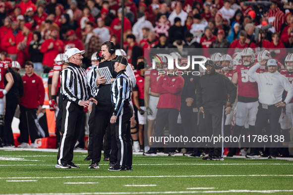 Wisconsin Badgers Head Coach Luke Fickell has a call explained to him on the field against The Oregon Ducks at Camp Randall Stadium in Madis...