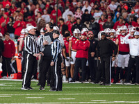 Wisconsin Badgers Head Coach Luke Fickell has a call explained to him on the field against The Oregon Ducks at Camp Randall Stadium in Madis...