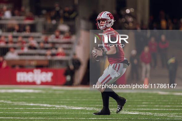 Wisconsin Badgers quarterback Braedyn Locke #18 looks downfield against the Oregon Ducks at Camp Randall Stadium in Madison, Wisconsin, on N...