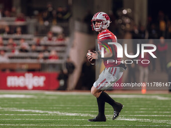 Wisconsin Badgers quarterback Braedyn Locke #18 looks downfield against the Oregon Ducks at Camp Randall Stadium in Madison, Wisconsin, on N...