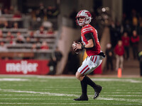 Wisconsin Badgers quarterback Braedyn Locke #18 looks downfield against the Oregon Ducks at Camp Randall Stadium in Madison, Wisconsin, on N...