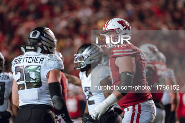 Wisconsin Badgers offensive lineman Jack Nelson #79 gives Oregon inside linebacker Bryce Boettcher #28 a smirk after a play at Camp Randall...