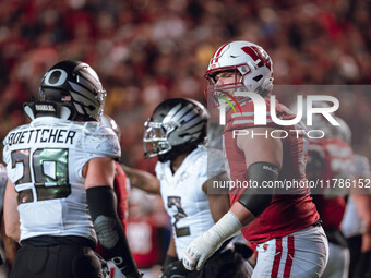 Wisconsin Badgers offensive lineman Jack Nelson #79 gives Oregon inside linebacker Bryce Boettcher #28 a smirk after a play at Camp Randall...