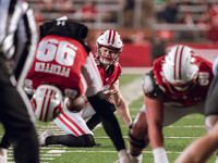 Wisconsin Badgers punter Gavin Meyers #28 prepares to hold a kick against the Oregon Ducks at Camp Randall Stadium in Madison, Wisconsin, on...