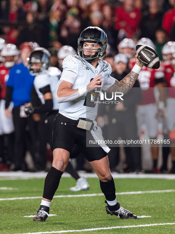 Oregon quarterback Dillon Gabriel #8 throws a pass against the Wisconsin Badgers at Camp Randall Stadium in Madison, Wisconsin, on November...