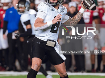 Oregon quarterback Dillon Gabriel #8 throws a pass against the Wisconsin Badgers at Camp Randall Stadium in Madison, Wisconsin, on November...