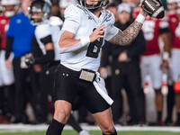 Oregon quarterback Dillon Gabriel #8 throws a pass against the Wisconsin Badgers at Camp Randall Stadium in Madison, Wisconsin, on November...