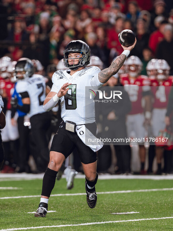 Oregon quarterback Dillon Gabriel #8 throws a pass against the Wisconsin Badgers at Camp Randall Stadium in Madison, Wisconsin, on November...