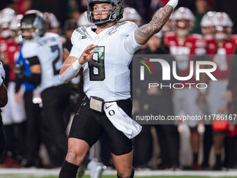 Oregon quarterback Dillon Gabriel #8 throws a pass against the Wisconsin Badgers at Camp Randall Stadium in Madison, Wisconsin, on November...