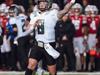 Oregon quarterback Dillon Gabriel #8 throws a pass against the Wisconsin Badgers at Camp Randall Stadium in Madison, Wisconsin, on November...