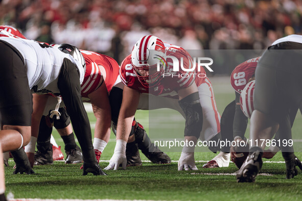 Wisconsin Badgers offensive lineman JP Benzschawel #67 takes a stance before an extra point against the Oregon Ducks at Camp Randall Stadium...