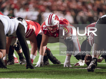 Wisconsin Badgers offensive lineman JP Benzschawel #67 takes a stance before an extra point against the Oregon Ducks at Camp Randall Stadium...