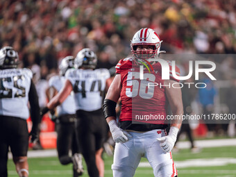 Wisconsin Badgers offensive lineman Joe Brunner #56 celebrates a score against the Oregon Ducks at Camp Randall Stadium in Madison, Wisconsi...