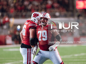 Wisconsin Badgers offensive lineman Joe Brunner #56 and Wisconsin Badgers offensive lineman Jack Nelson #79 celebrate a score against the Or...