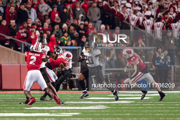 Oregon running back Jordan James #20 gives a stiff arm against the Wisconsin Badgers at Camp Randall Stadium in Madison, Wisconsin, on Novem...