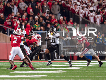 Oregon running back Jordan James #20 gives a stiff arm against the Wisconsin Badgers at Camp Randall Stadium in Madison, Wisconsin, on Novem...